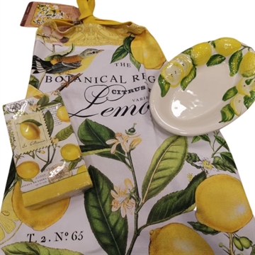 Gavekurv med forklæde, keramikfad og servietter med citroner